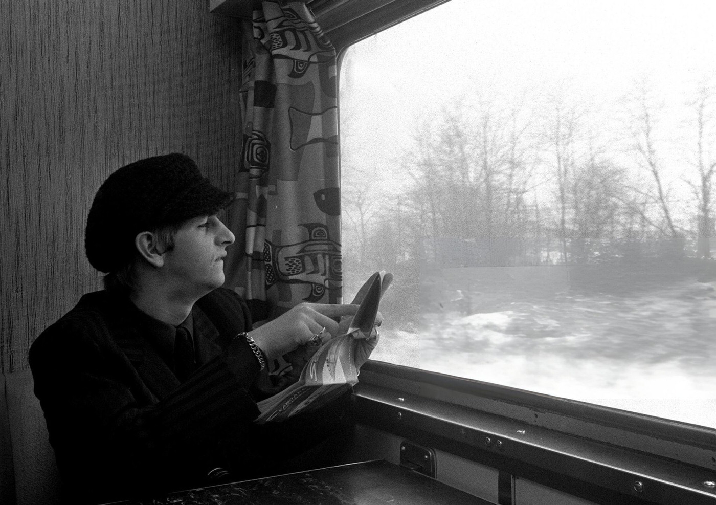 Ringo Starr, Drummer Of The British Pop Group The Beatles Looks Out Of His Window As The Band Travel On The Train From New York To Washington During Their Tour Of The States, 1964.