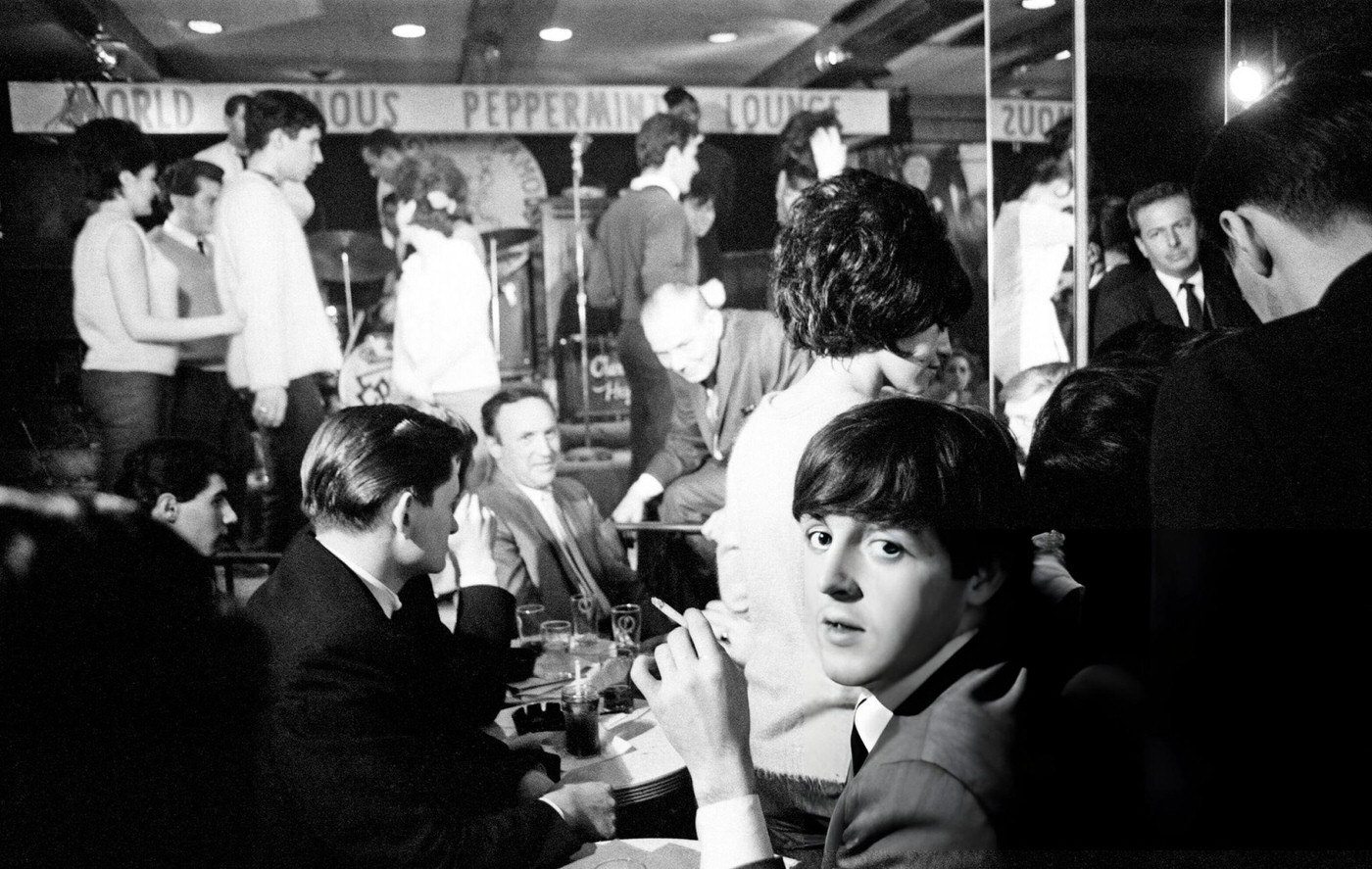 Paul Mccartney (Seated Looking Round To The Camera) Of The Beatles, New York, Usa, At The Peppermint Lounge. The Beatles Arrived In Us On Friday 7Th February 1964.