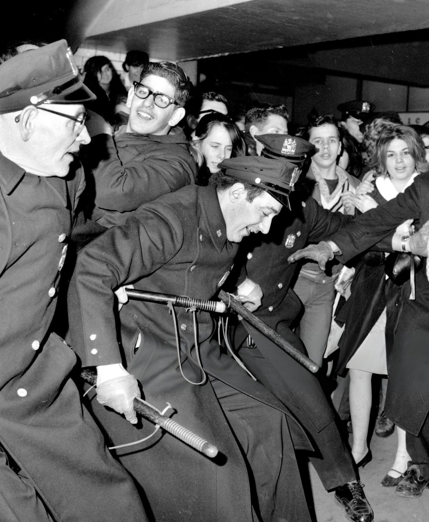 Police Restrain Beatles Fans At Penn Station, 1964.