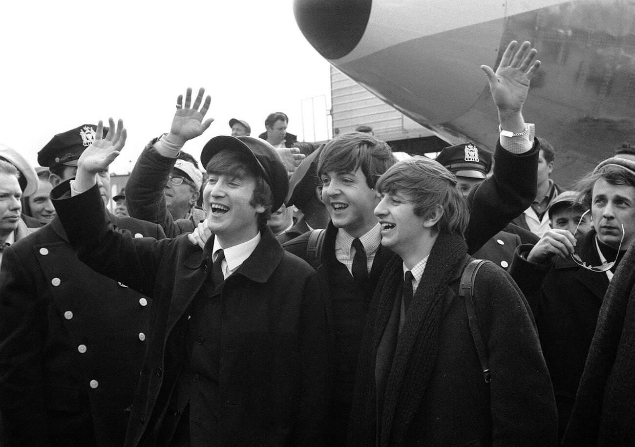 John Lennon, Paul Mccartney, And Ringo Starr Wave To Fans And Press Upon Their Arrival In America, 1964.