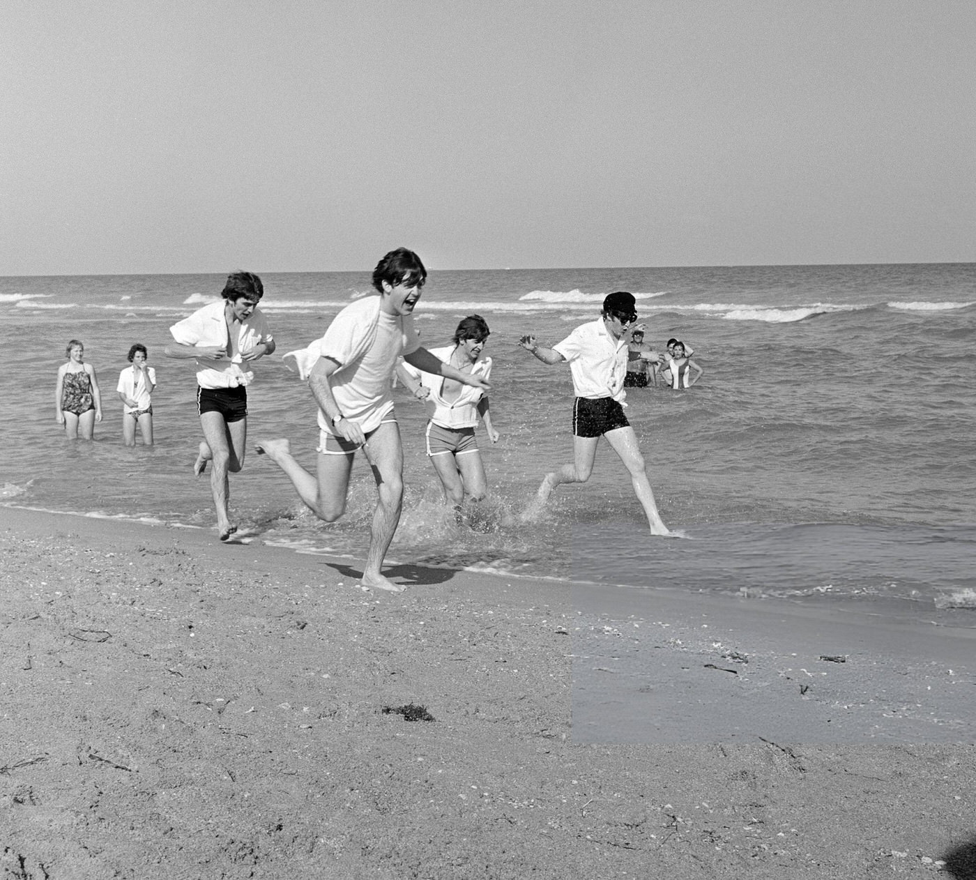 The Beatles Enjoy The Sun At Miami Beach, Florida. The Band Was In Florida To Appear On The Ed Sullivan Show At The Deauville Hotel. From Left: George Harrison, Paul Mccartney, Ringo Starr, And John Lennon.