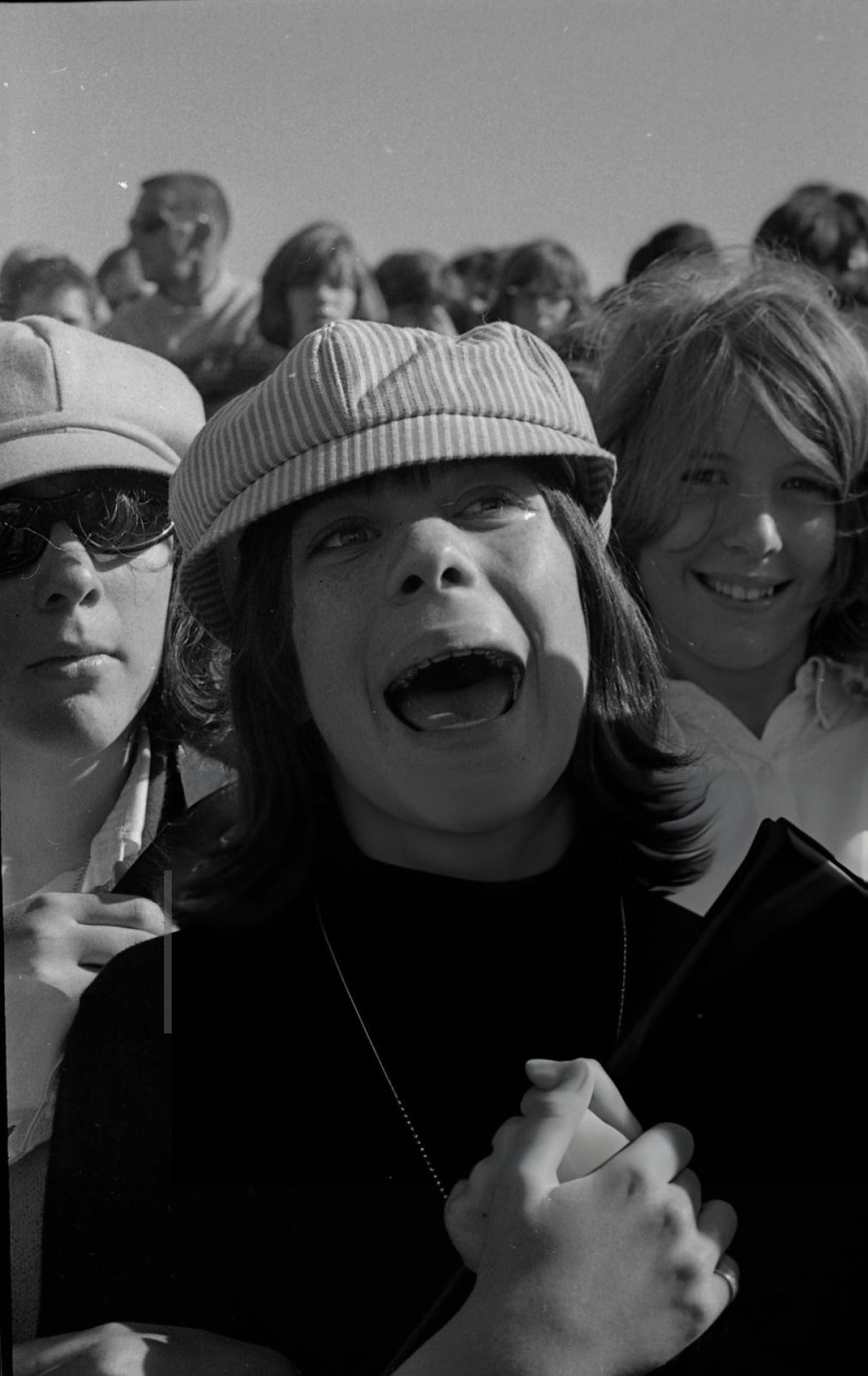 Police Try To Maintain Order As Crowds Of Fans Wait For The Beatles At San Francisco International Airport.