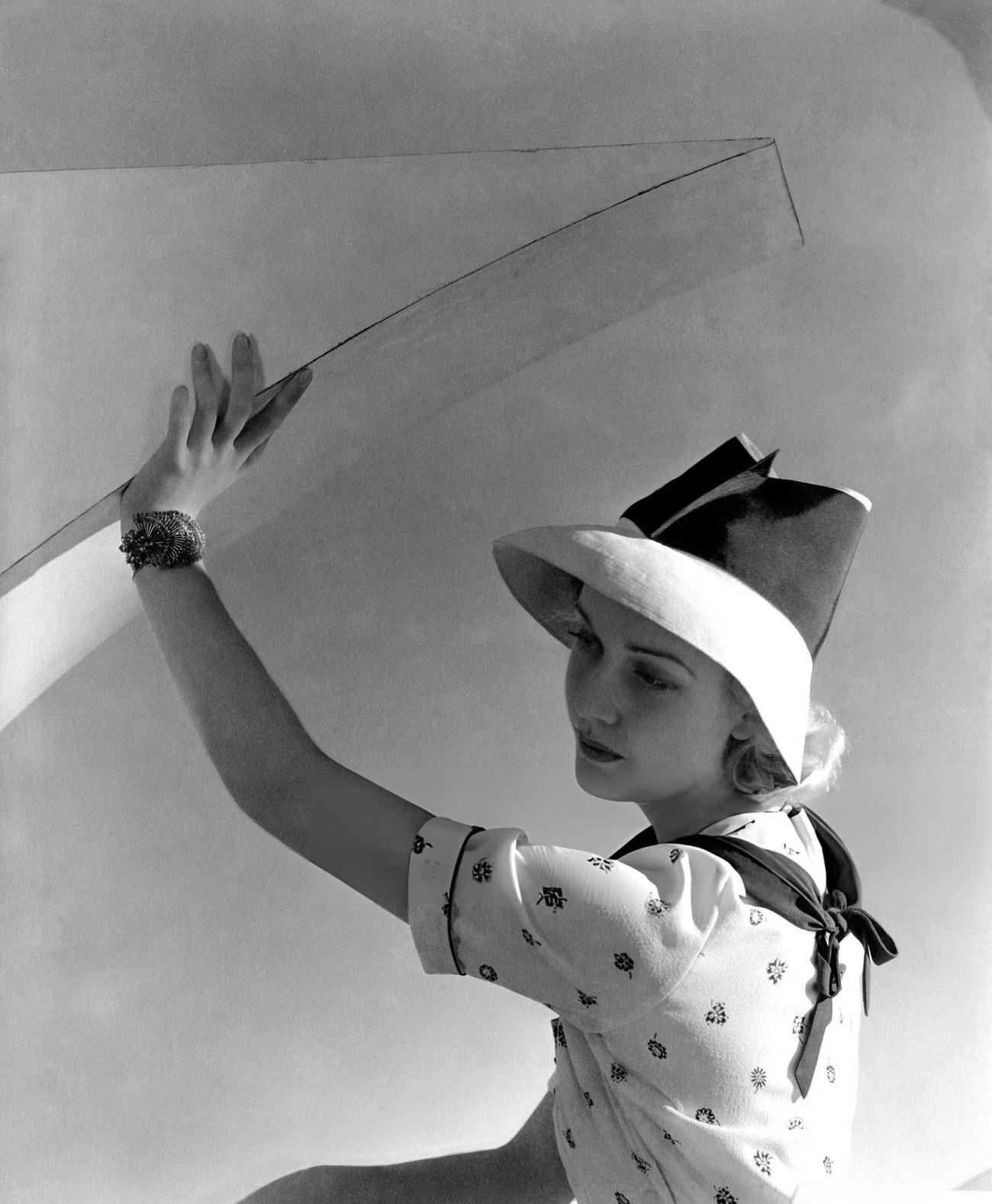 Anita Louise, Actress, Wearing A Floral-Print Crepe Dress And High, Opened-Crowned Toyo Hat With A Wide Grosgrain Band, 1936.