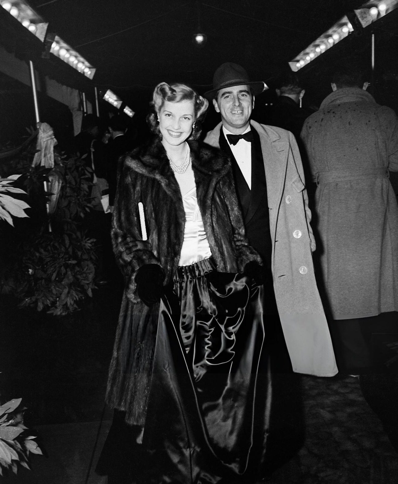 Anita Louise And Husband Producer E. Maurice Adler Attend An Event In Los Angeles, California, Circa 1940.