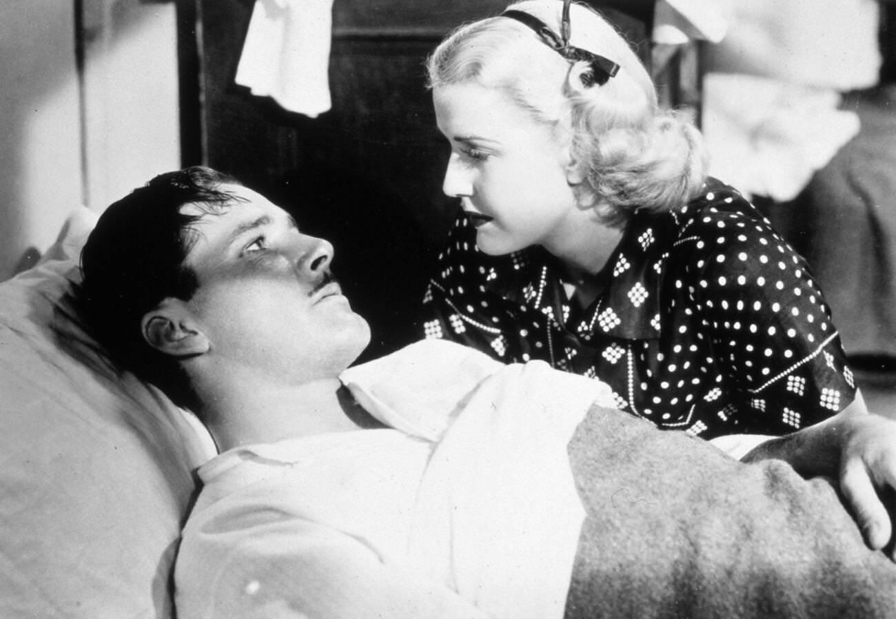 Frank Borzage Embracing Errol Flynn And Anita Louise On The Set Of 'Green Light', 1937.