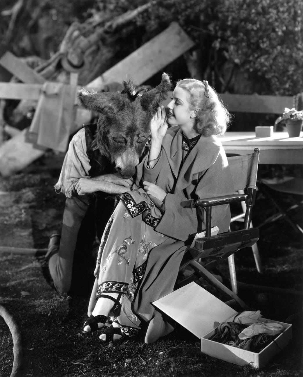 James Cagney Wearing A Donkey Head Mask And Anita Louise On Set Of 'A Midsummer Night'S Dream', Directed By Max Reinhardt And William Dieterle, 1935.