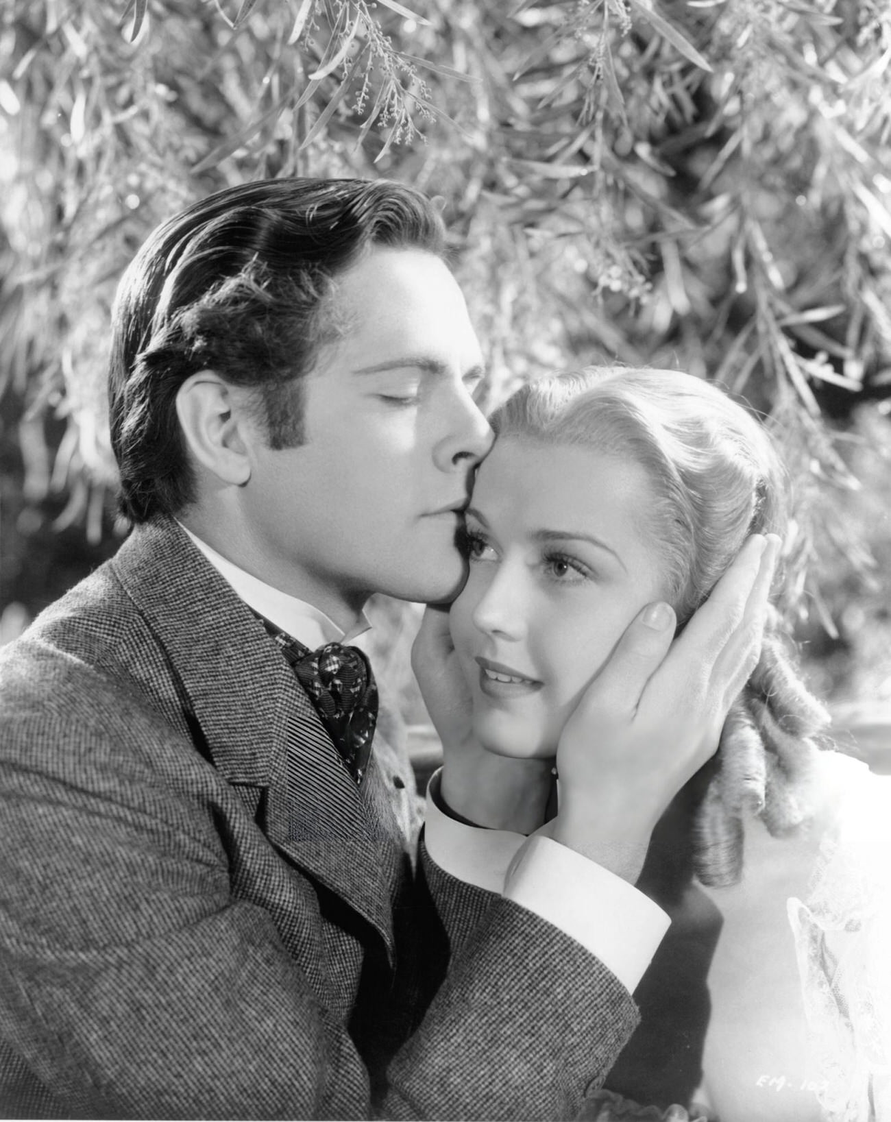 Donald Cook Kissing Anita Louise'S Head In A Scene From The Film 'The Story Of Louis Pasteur', 1936.