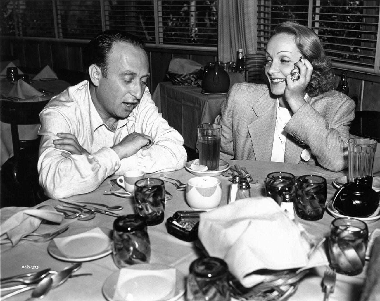 Marlene Dietrich And Producer Joe Pasternak Having Lunch, 1939.