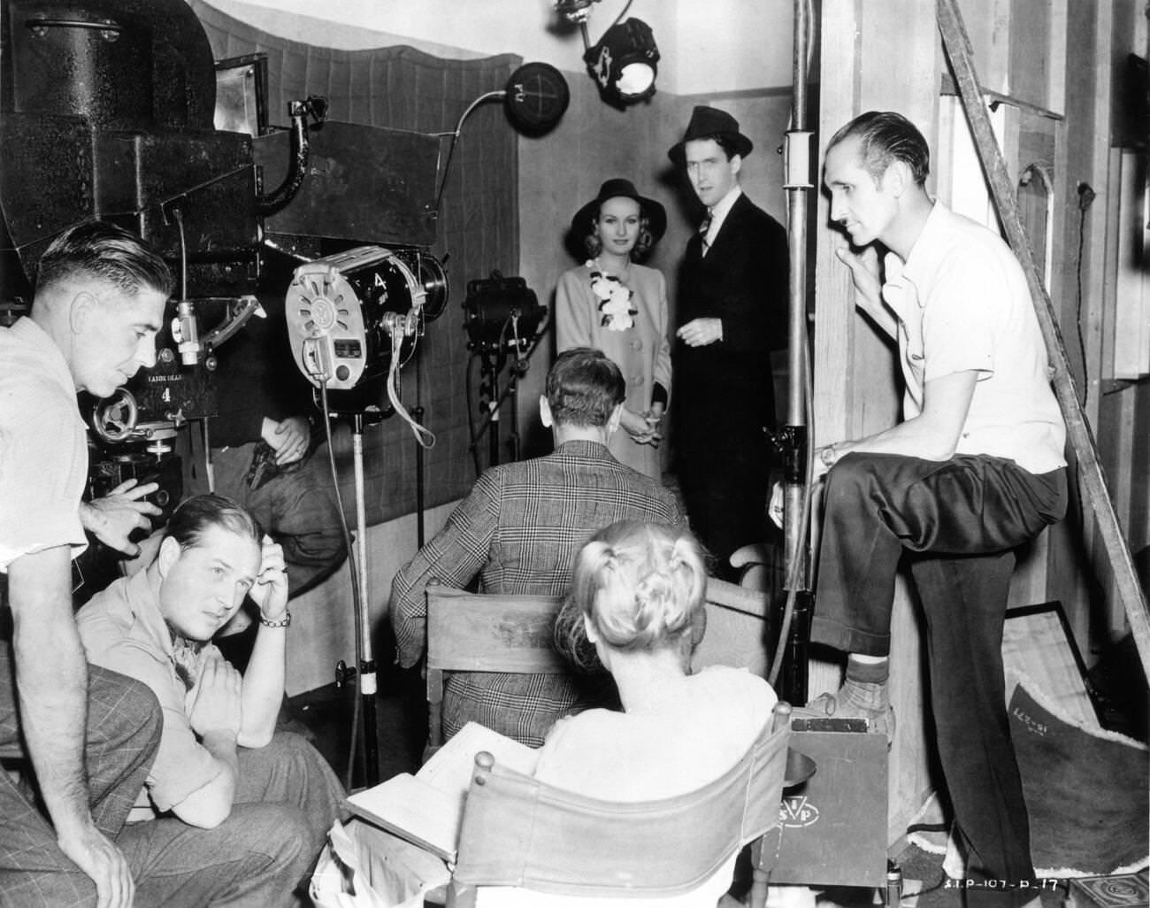 Carole Lombard And James Stewart Rehearse A Love Scene With Director John Cromwell, 1939.