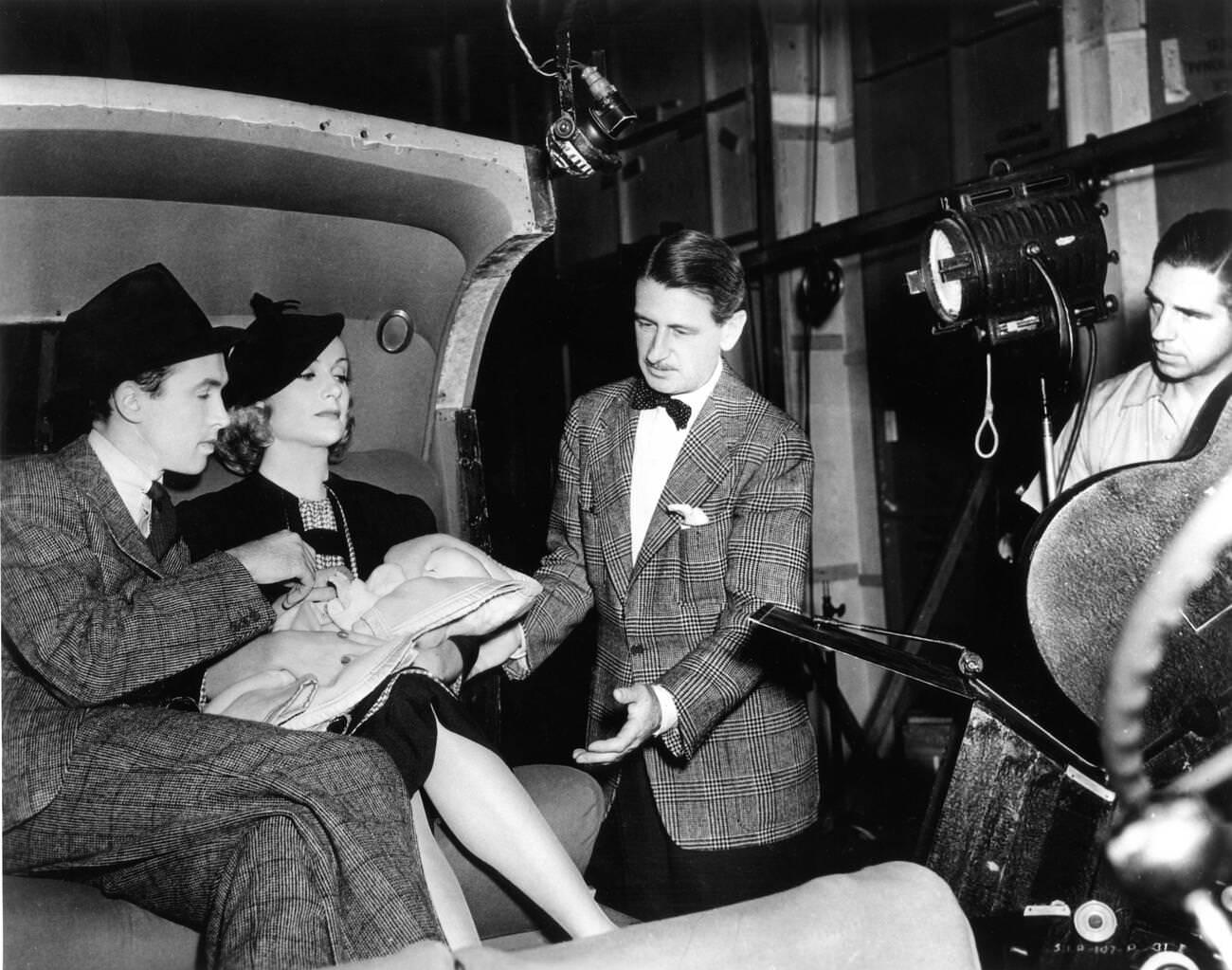 James Stewart, Carole Lombard, Director John Cromwell, And A Crew Member On Set During The Filming Of 'Made For Each Other', 1939.