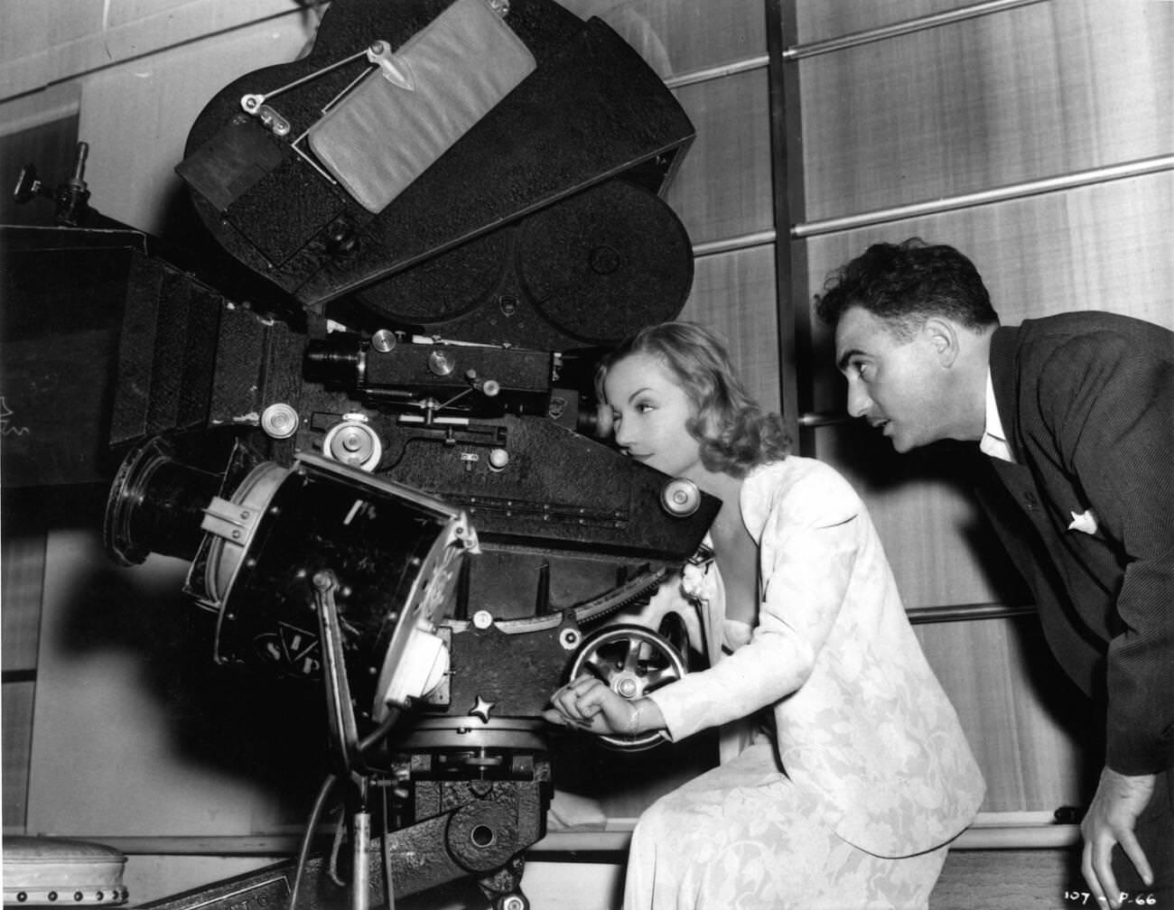 Carole Lombard And Cinematographer Leon Shamroy On Set, 1939.