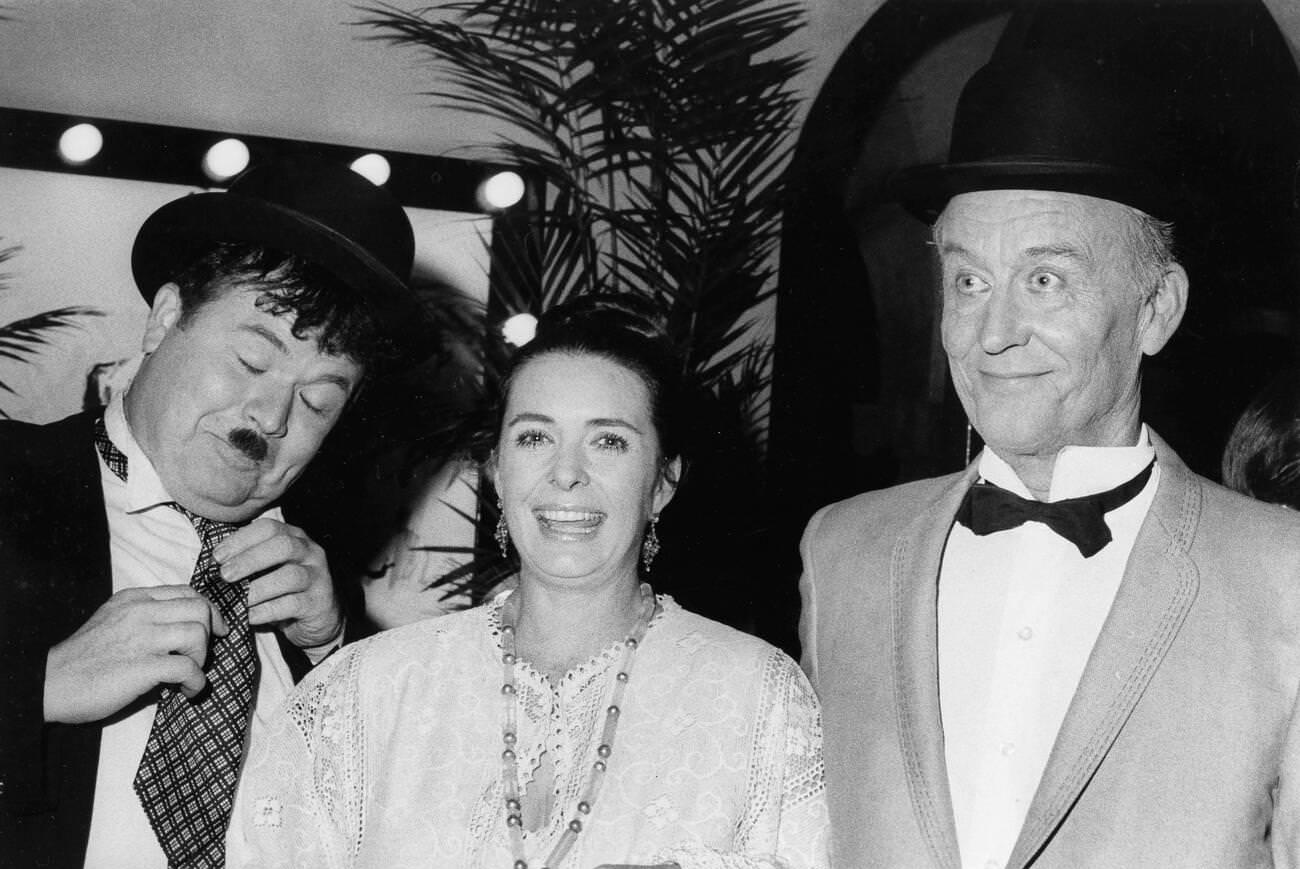 Margaret O'Brien With Stan Laurel And Oliver Hardy Impersonators At A City Of Hope Charity Event, 1976.