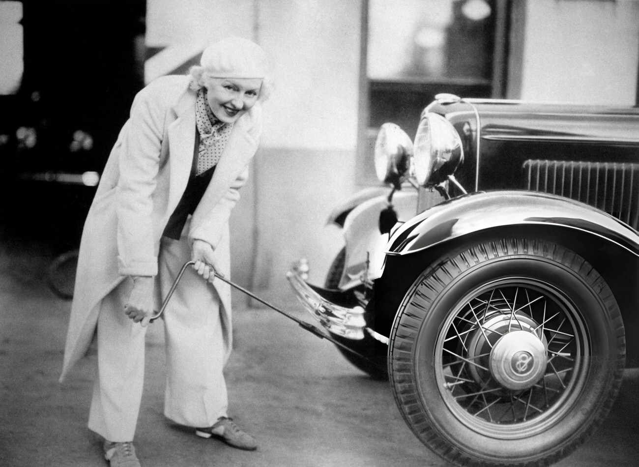 Peggy Hopkins Joyce Changing A Tire In Los Angeles, 1933.