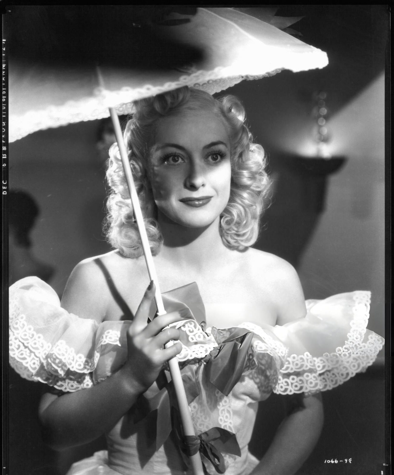 Joan Crawford Holding An Umbrella In A Scene From The Film 'The Ice Follies Of 1939', 1939