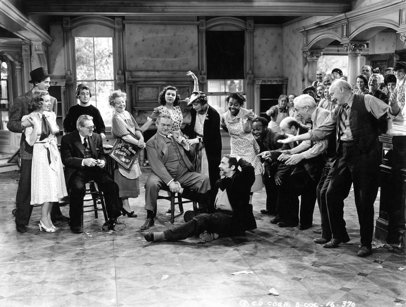 James Stewart, Jean Arthur, Dub Taylor, Lionel Barrymore, Spring Byington, Edward Arnold, Ann Miller, Mary Forbes, Mischa Auer, Lillian Yarbo, Eddie 'Rochester' Anderson, Donald Meek, Samuel S. Hinds, And Halliwell Hobbes In &Amp;Quot;You Can'T Take It With You&Amp;Quot;, 1938.