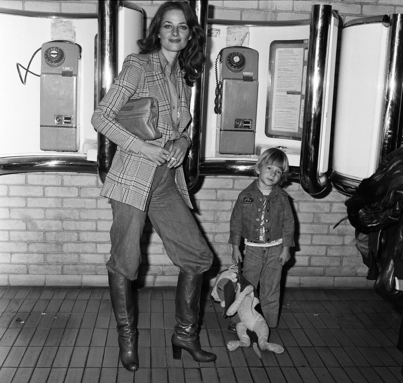 Charlotte Rampling At Heathrow Airport With Her Son Barnaby, 1976.