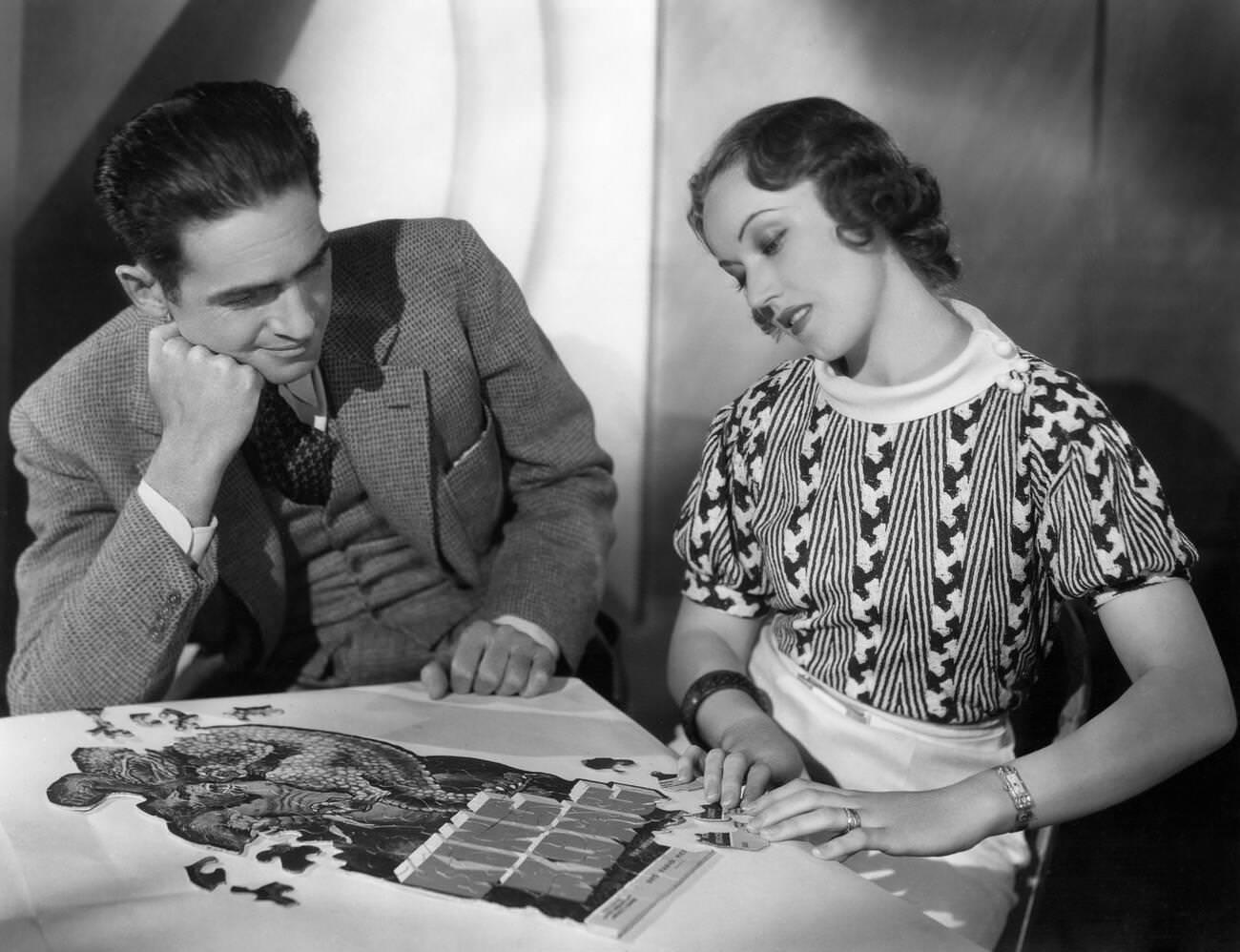 Director Ernest Schoedsack, Fay Wray Assembling The King Kong Jigsaw Puzzle, 1933.