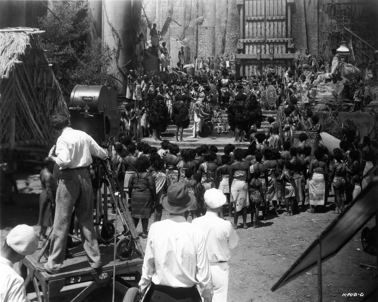 Camera Crew Filming Native Ritual In Front Of Gates On Skull Island Set For King Kong, 1933.