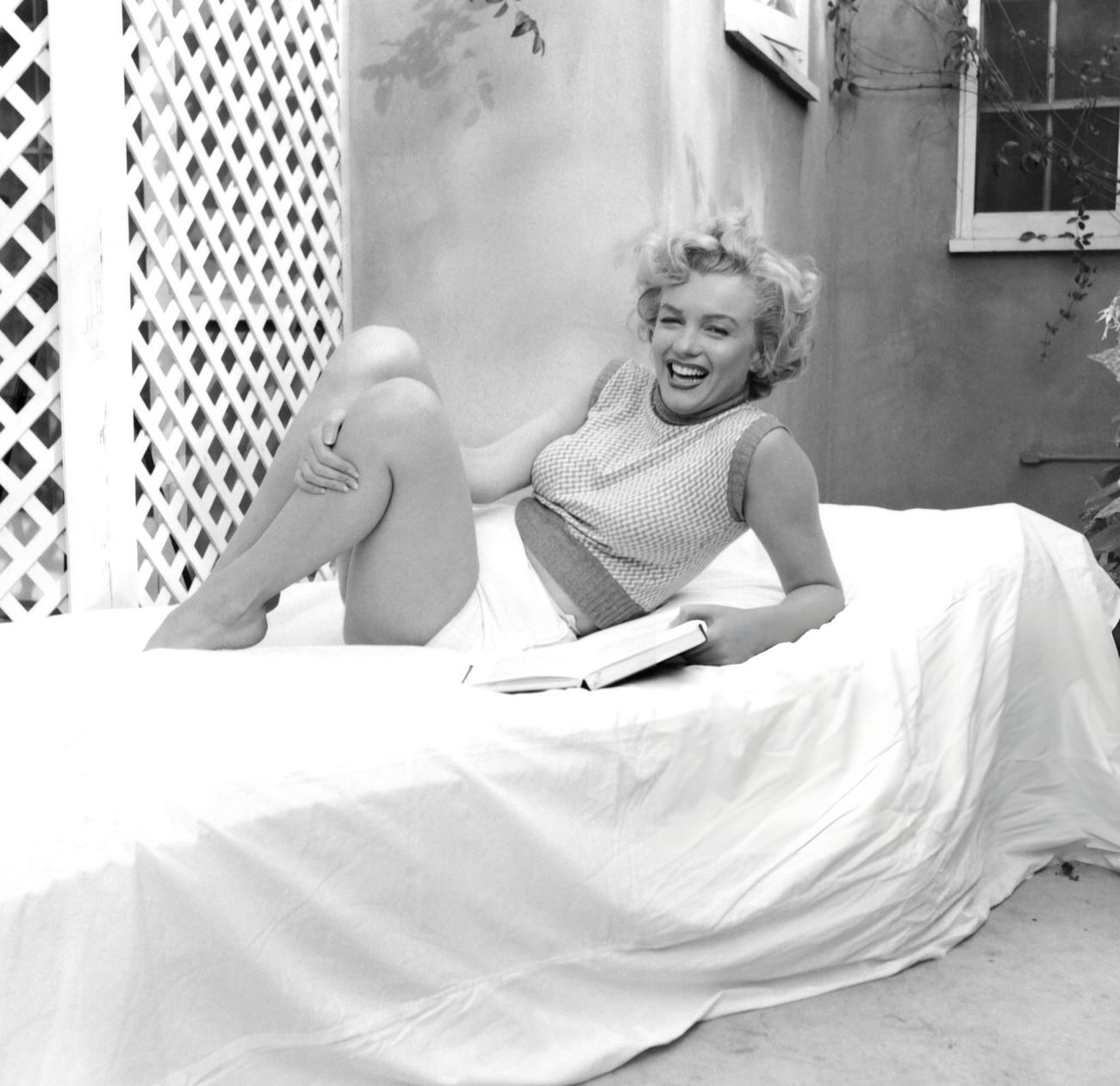 Marilyn Monroe On A Towel-Covered Deckchair At The Hotel Bel-Air, 1953.