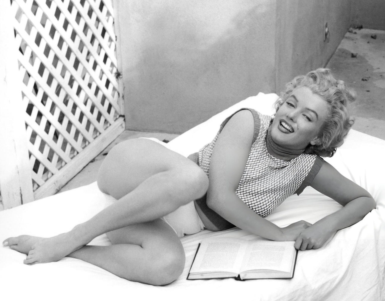 Marilyn Monroe On A Towel-Covered Deckchair At The Hotel Bel-Air, 1953.