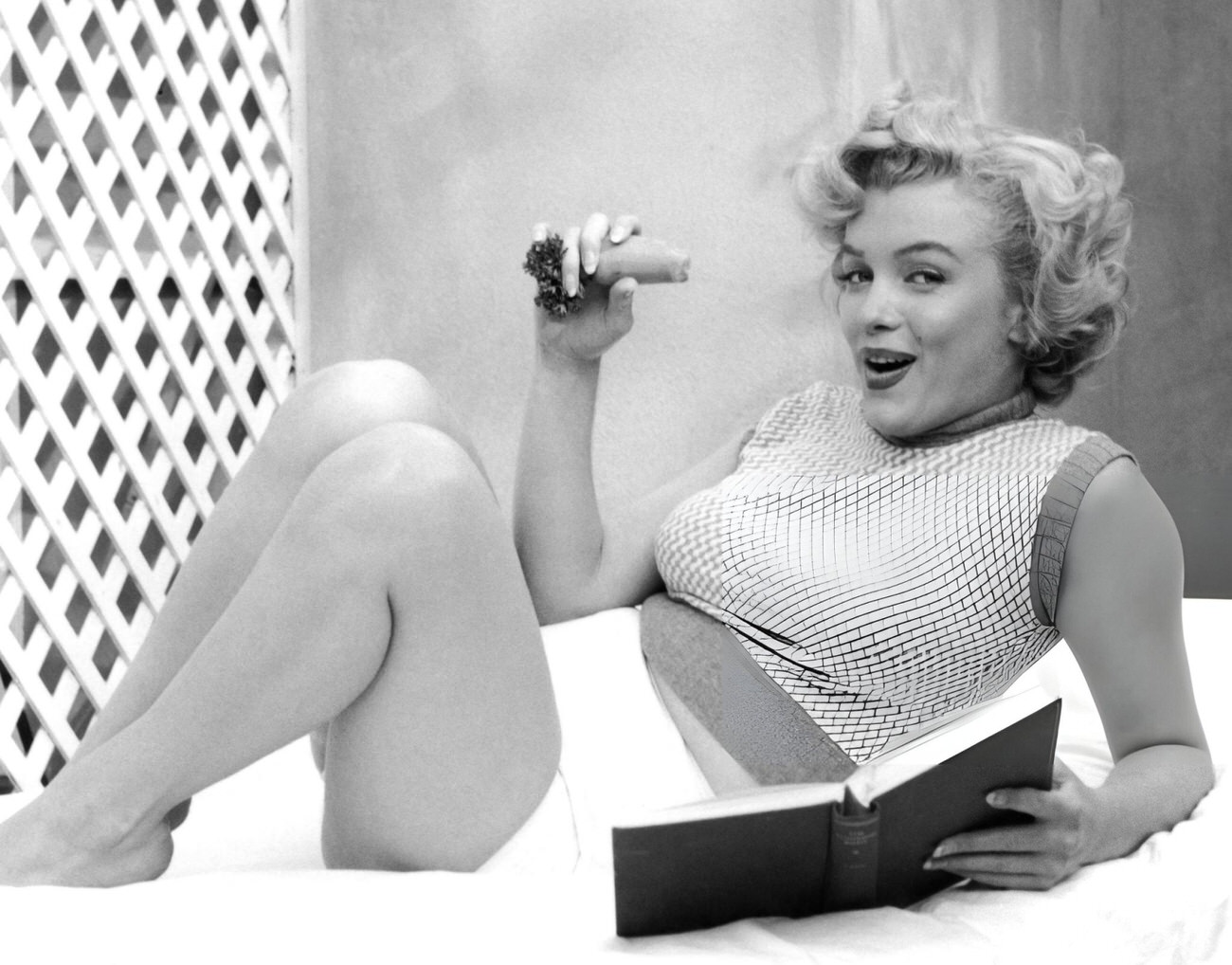 Marilyn Monroe Lying On A Towel-Covered Deckchair At The Hotel Bel-Air, 1953.