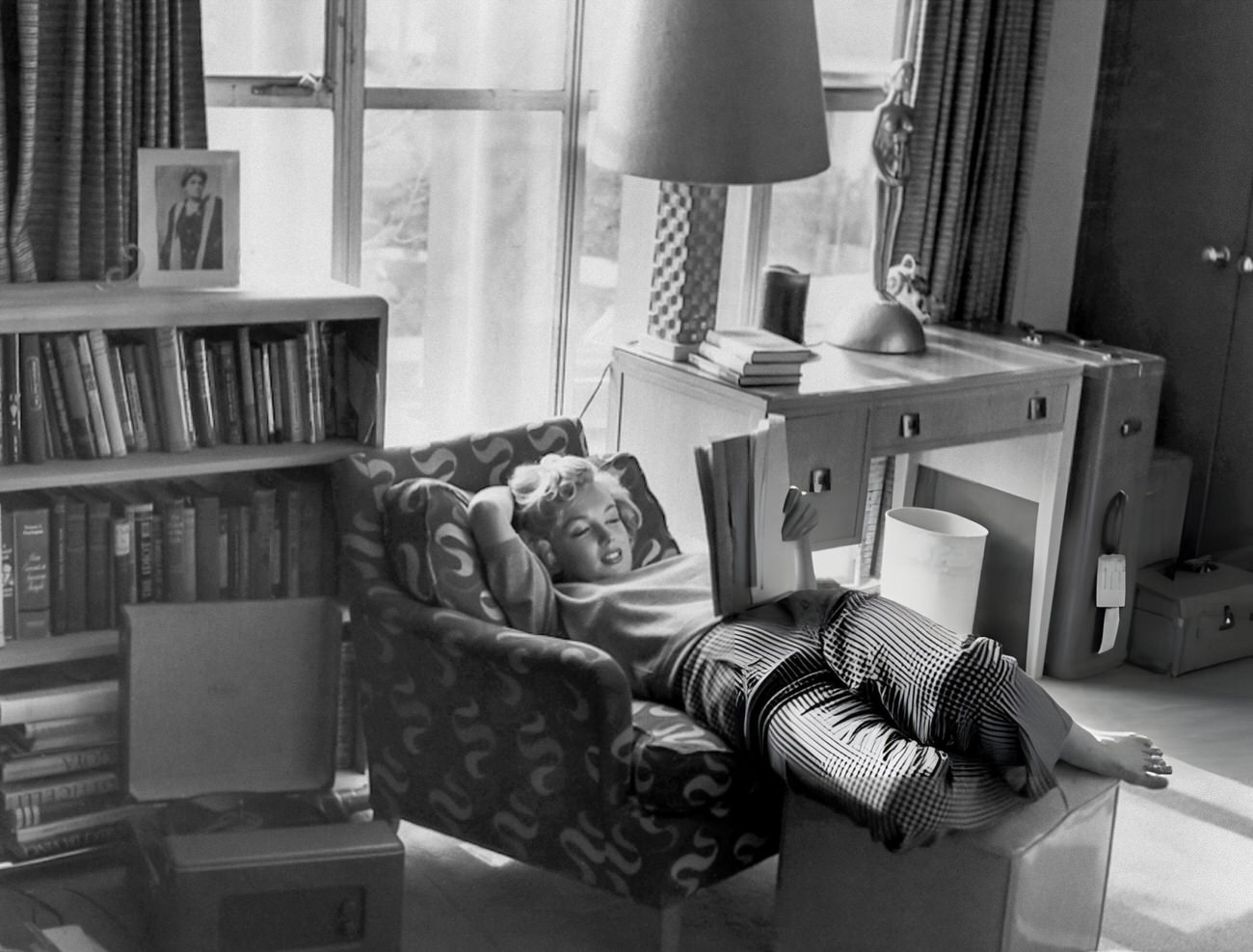 Marilyn Monroe Reading A Script In An Armchair At The Hotel Bel-Air, 1953.