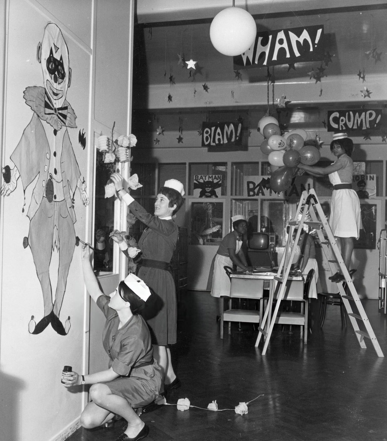 Nurses At The Princess Louise, Kensington Hospital For Children, Ladbroke Grove, London Help Sister Janet New Put Up Batman Decorations For Christmas, 1960S.
