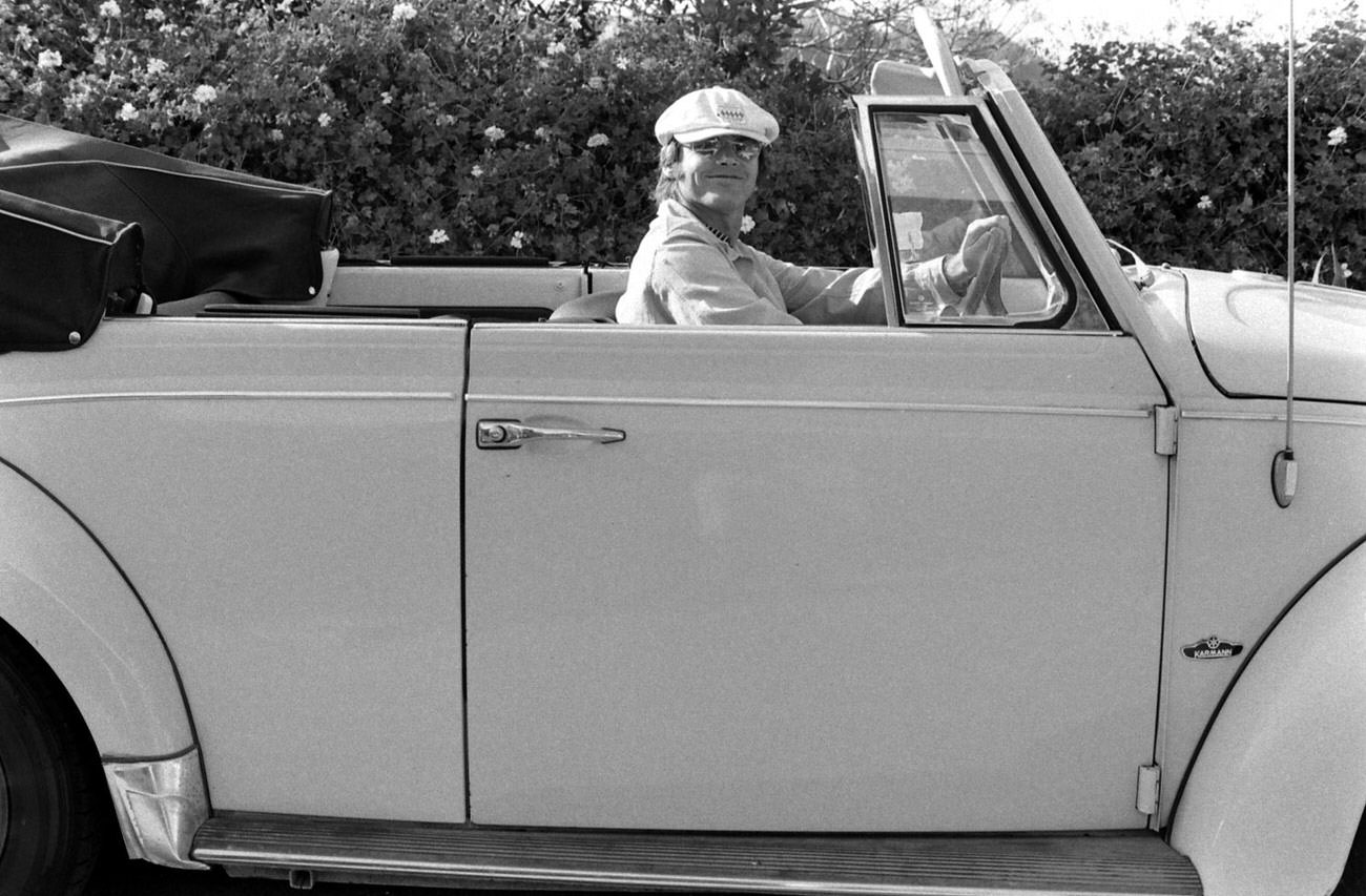 Jack Nicholson — Wearing What Typewritten Notes By Writer Judy Fayard Called &Amp;Quot;His Standard Driving Regalia: Peaked Cap, Grand Prix Medallion And Yellow Shades — In His Yellow Volkswagen Convertible, Los Angeles, 1969.