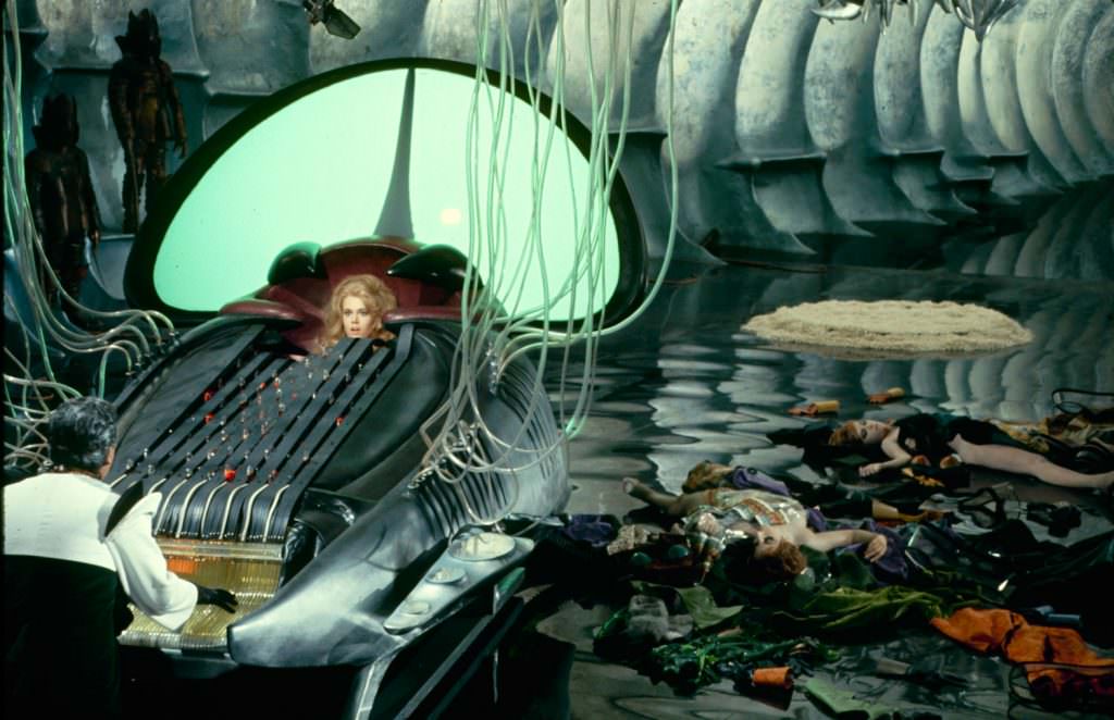 Jane Fonda At The Mercy Of The Evil Durand-Durand (Milo O’shea) In The “Excessive Machine” On The Set Of Barbarella, 1968.