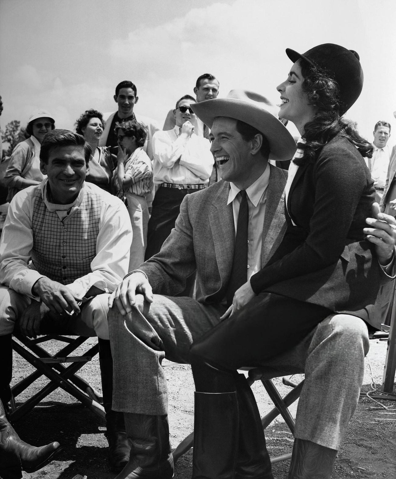 Rock Hudson And Elizabeth Taylor Surrounded By Fans In Marfa, Texas, During The Filming Of ‘Giant’, 1956