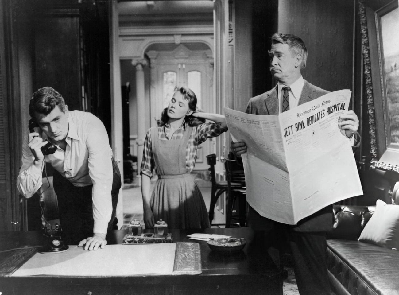 Rock Hudson On The Phone As Carroll Baker Watches In ‘Giant’, 1956