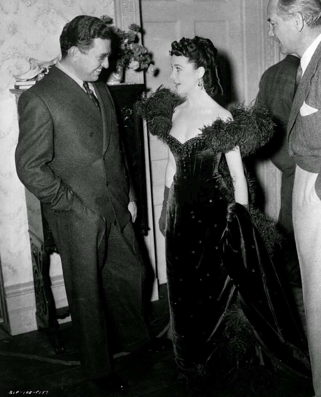 Vivian Leigh As Scarlett O'Hara, Wearing Red Gown, Talking To Producer David O. Selznick And Director Victor Fleming, Between Takes Of Ashley'S Birthday Party.