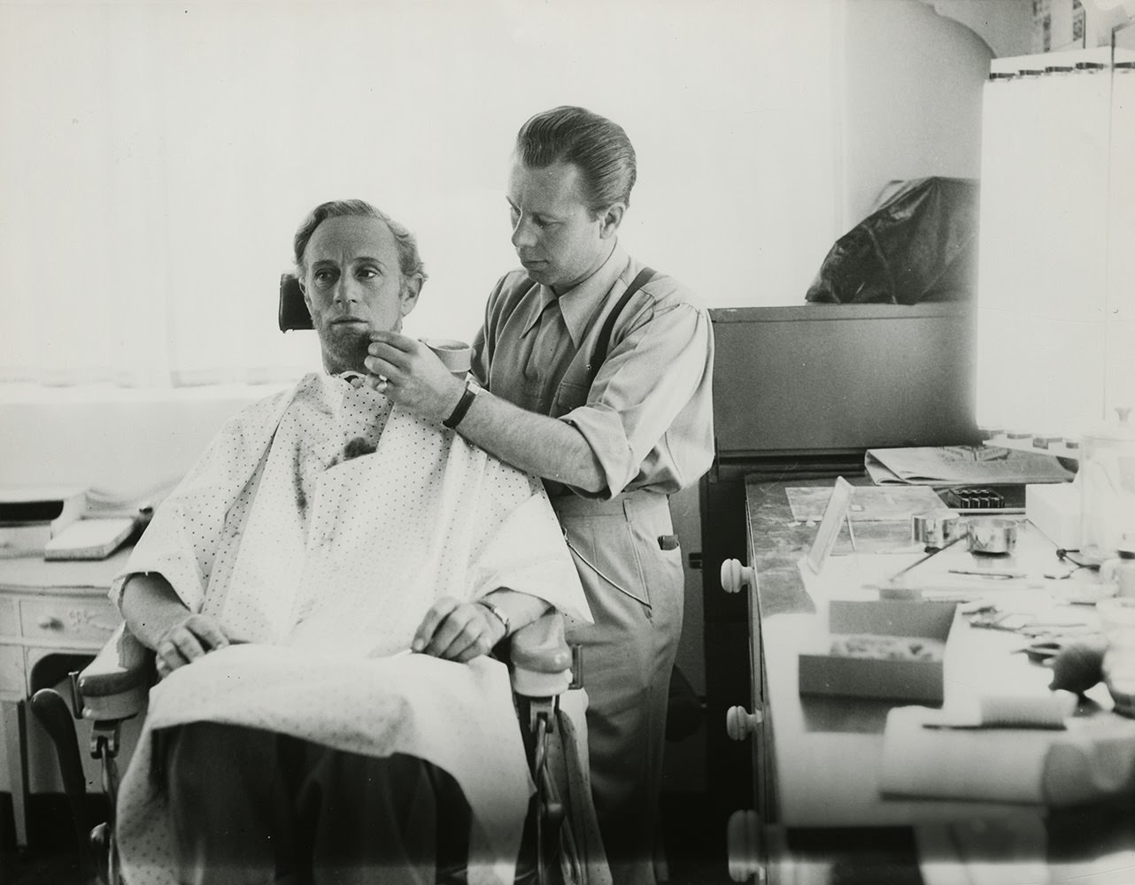 Make Up Artist Monte Westmore Applies Make Up To Actor Leslie Howard In The Role Of Ashley.