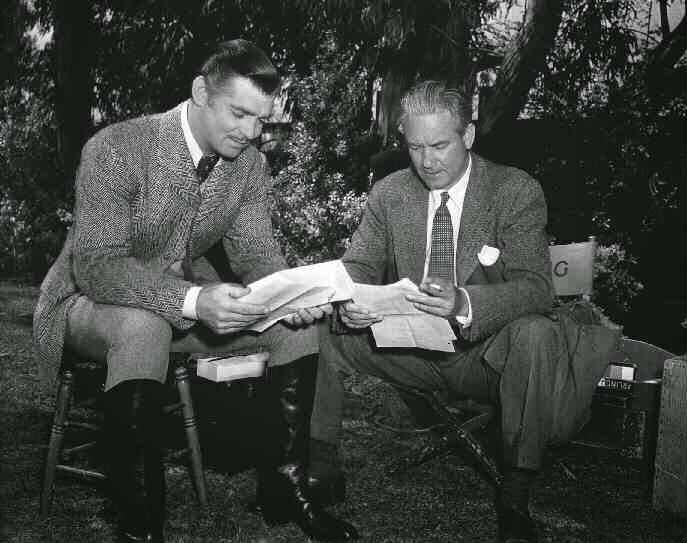 Clark Gable And Director Victor Fleming, Seated, Reading Script Notes.