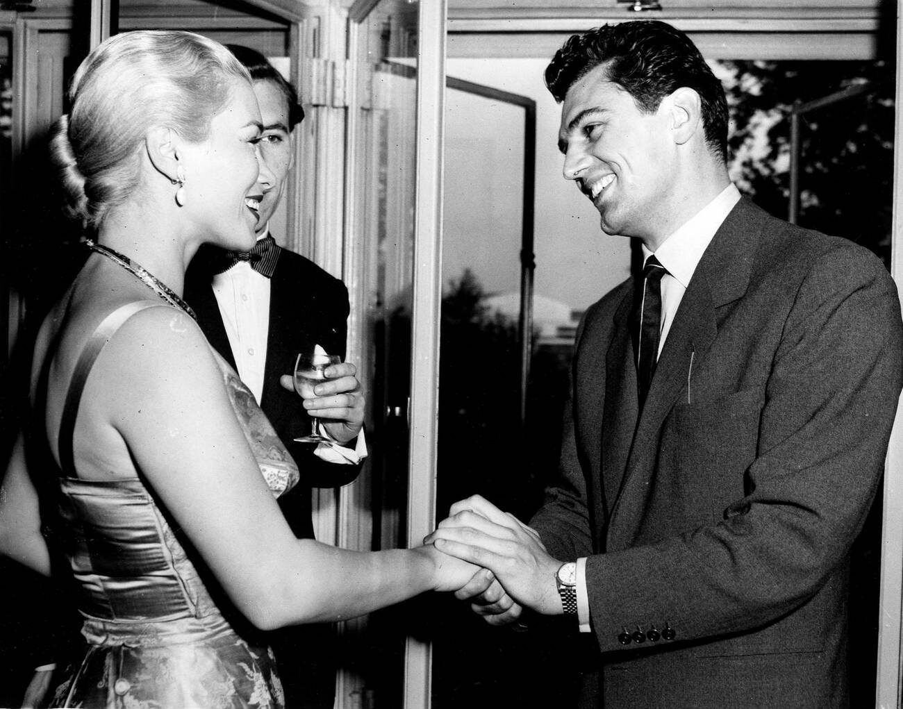 Linda Christian And Edmund Purdom At A Party.