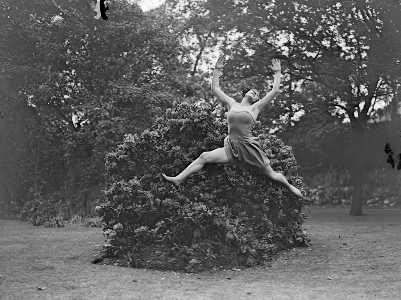 A Margaret Morris Movement Dancer Leaping In A Park, 1928.