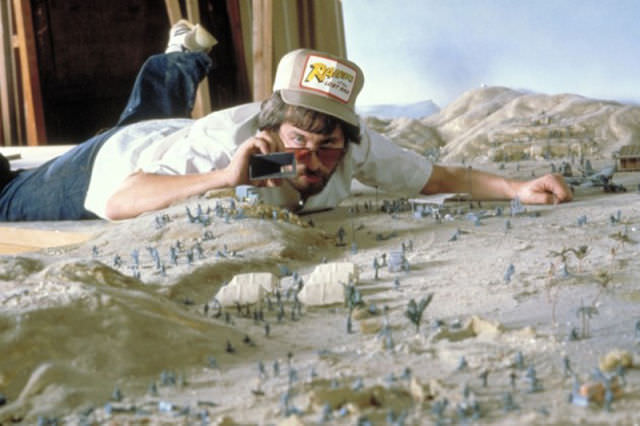 Steven Spielberg Setting Up A Shot Of Miniatures