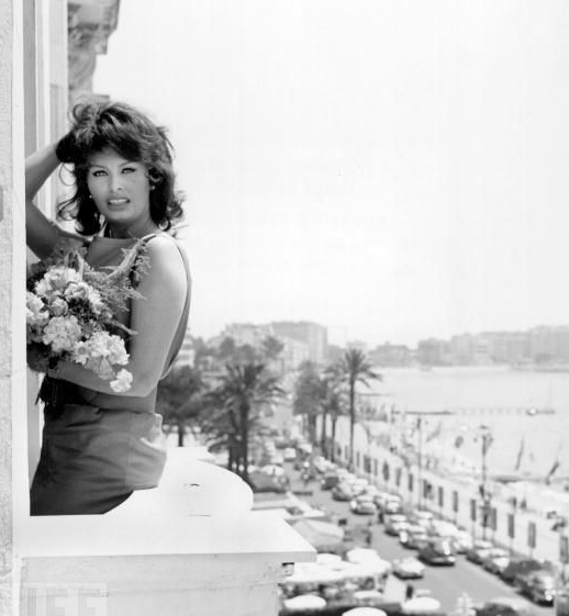 Sophia Loren Poses With Flowers On The Balcony Of Her Cannes Hotel, 1959.