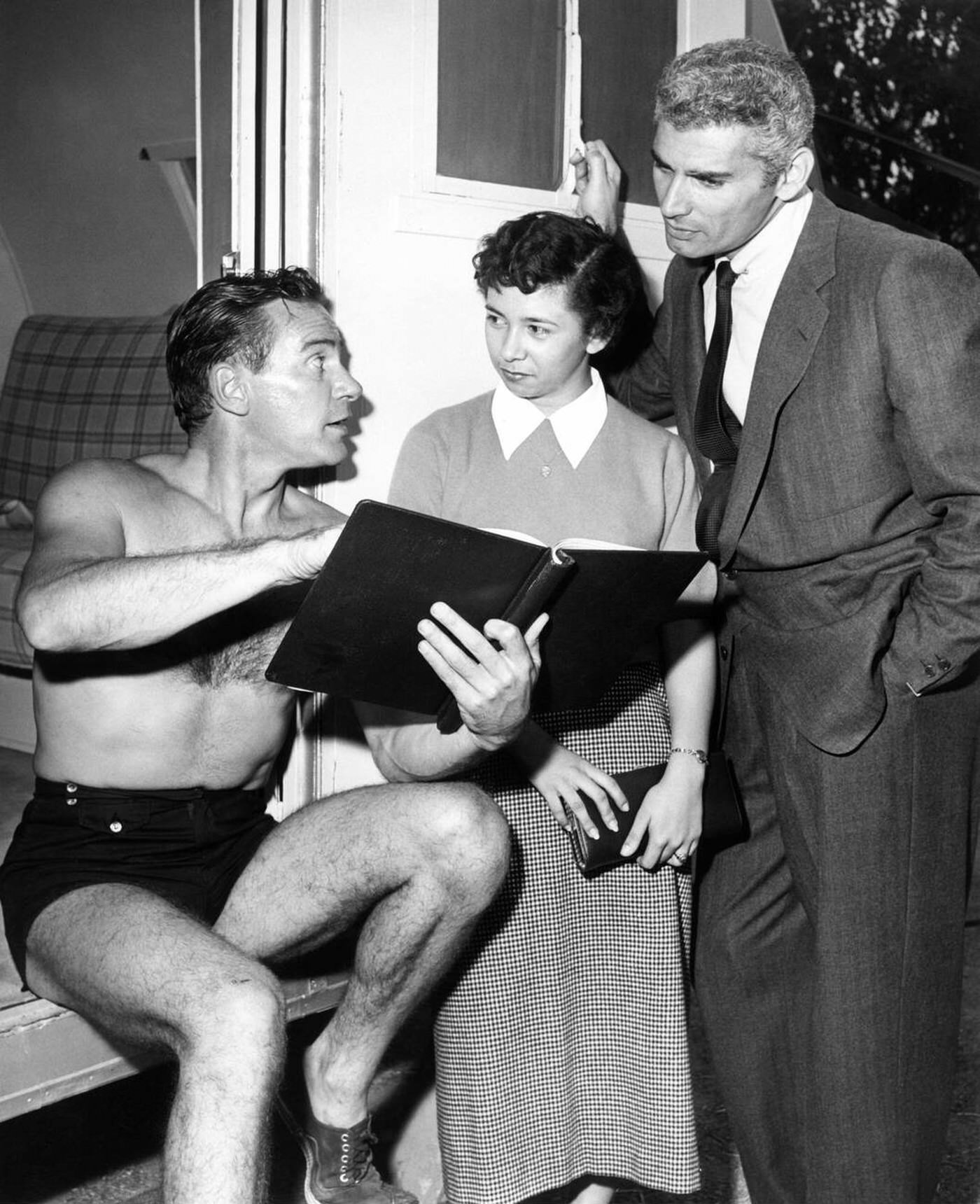 Richard Carlson In His Trailer Dressing Room Visited By Jeff Chandler And A Fan During Filming Of 'Creature From The Black Lagoon', 1954.