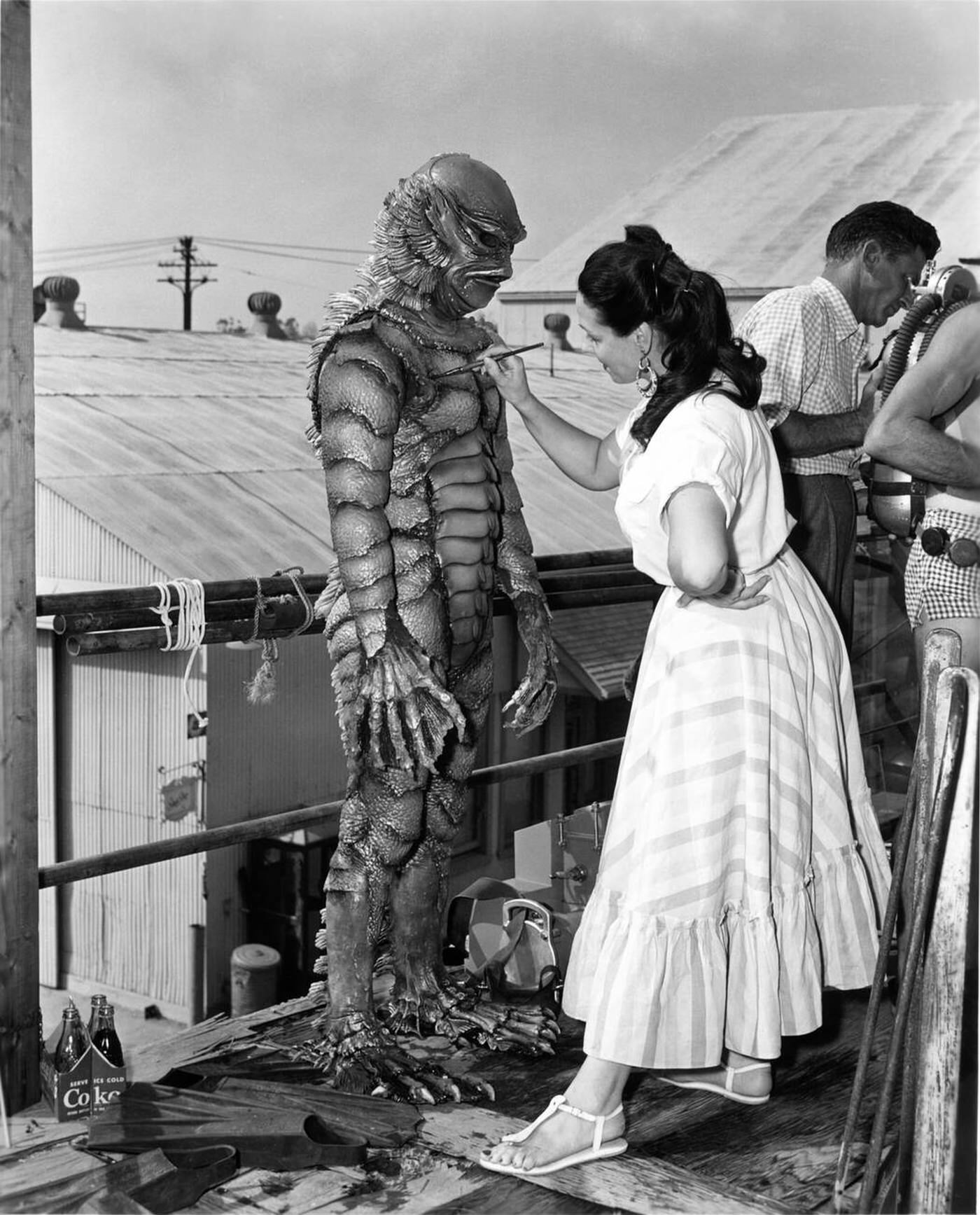 The Gill Man On Set Having Touch Up From Make-Up Artist During Filming Of 'Creature From The Black Lagoon', 1954.