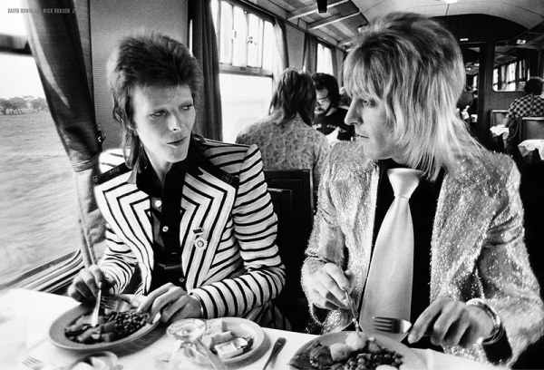 David Bowie And Mick Ronson Enjoy Lunch On The Train, 1973.