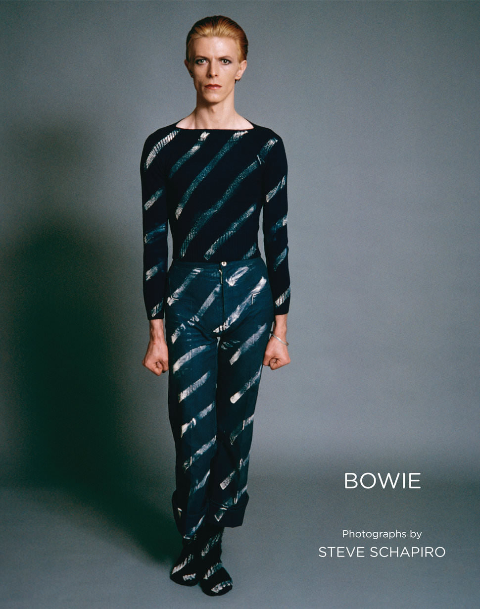 The Book Bowie'S Cover Features An Image Of Bowie Dressed In Blue Slacks And Cropped Shirt, 1976.
