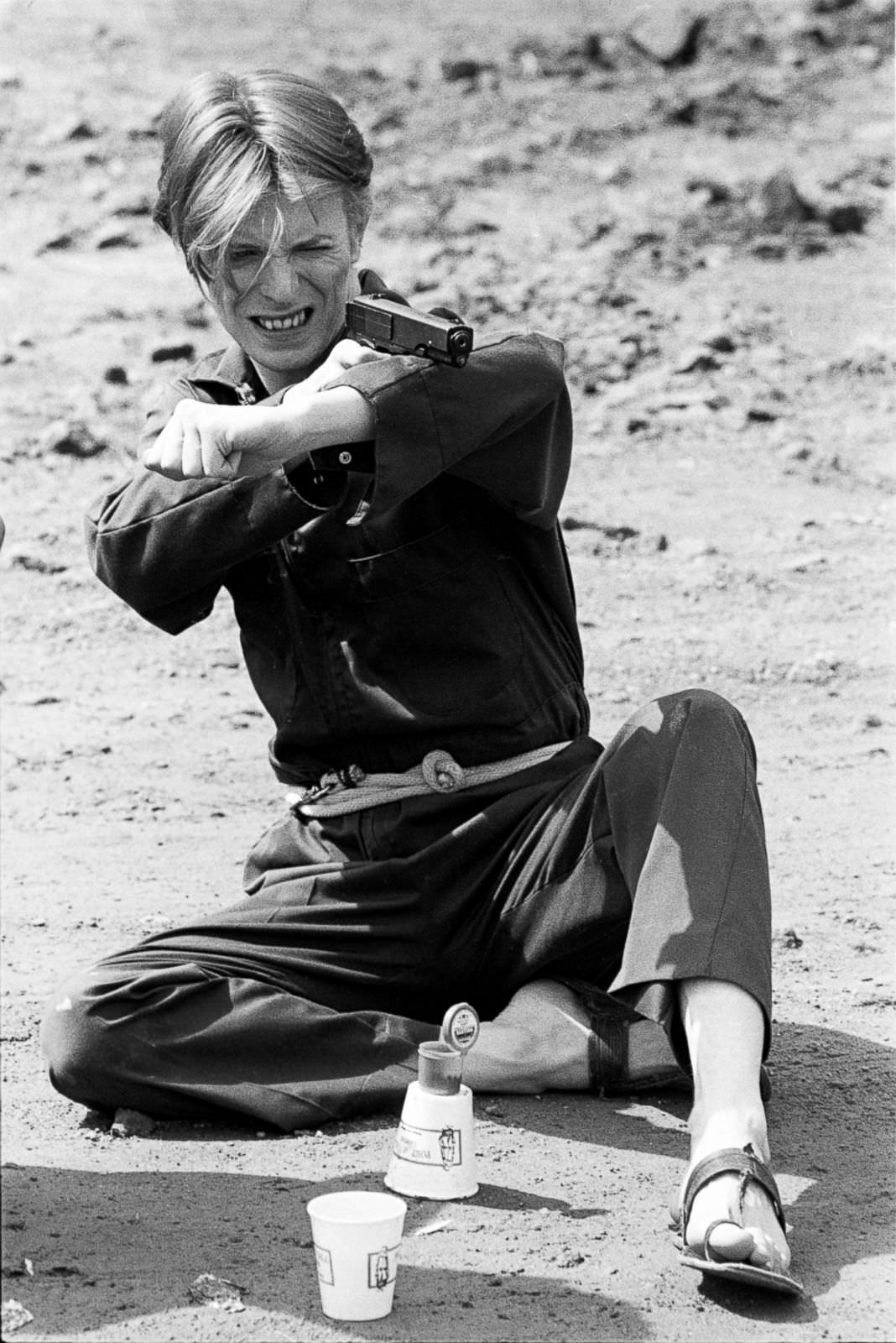 Bowie Doing Target Practice On A Break From Shooting On The Man Who Fell To Earth, New Mexico, 1975.