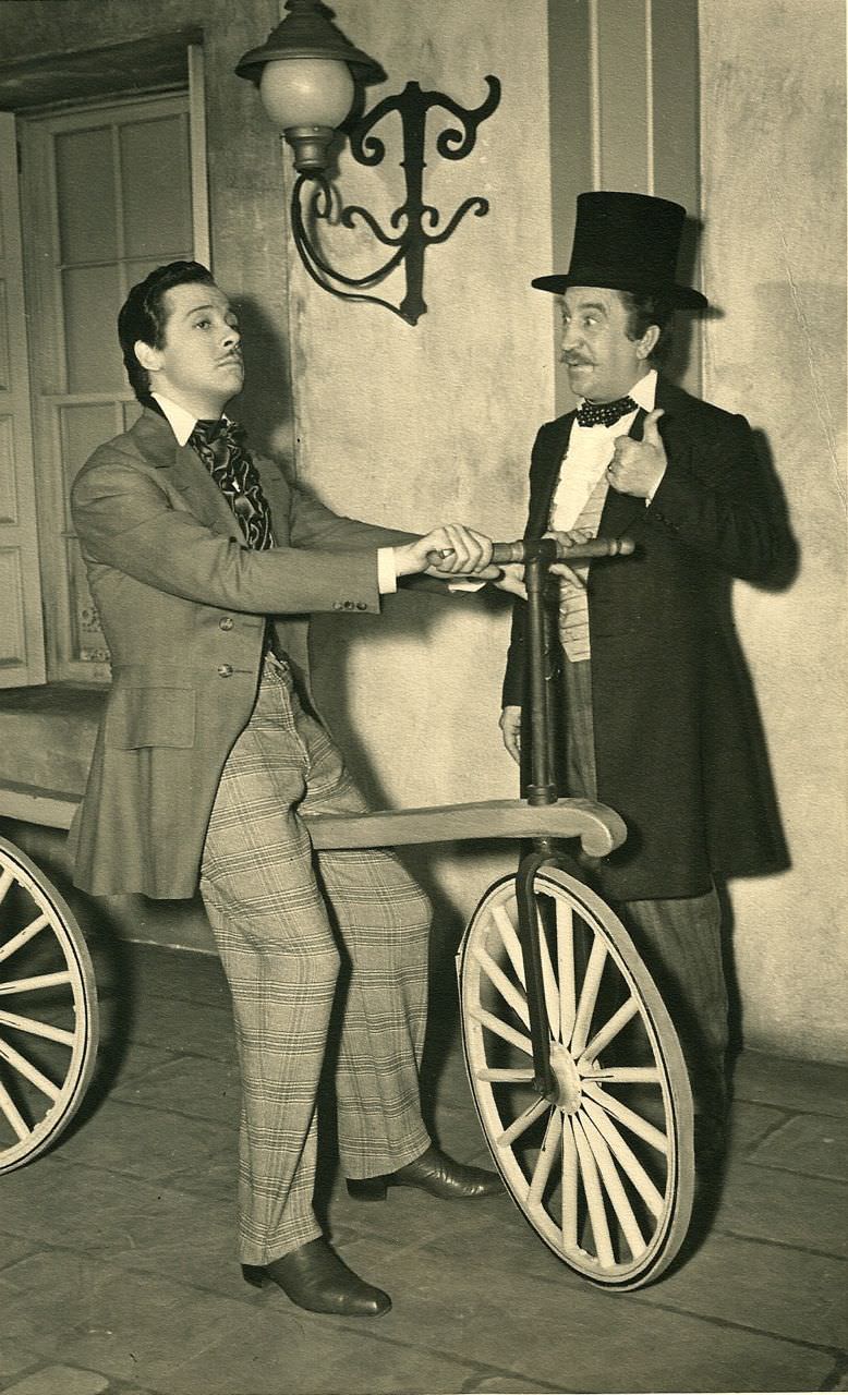 Fernand Gravey Rides A Velocipede. Hugh Herbert Gives Thumbs Up. 1938