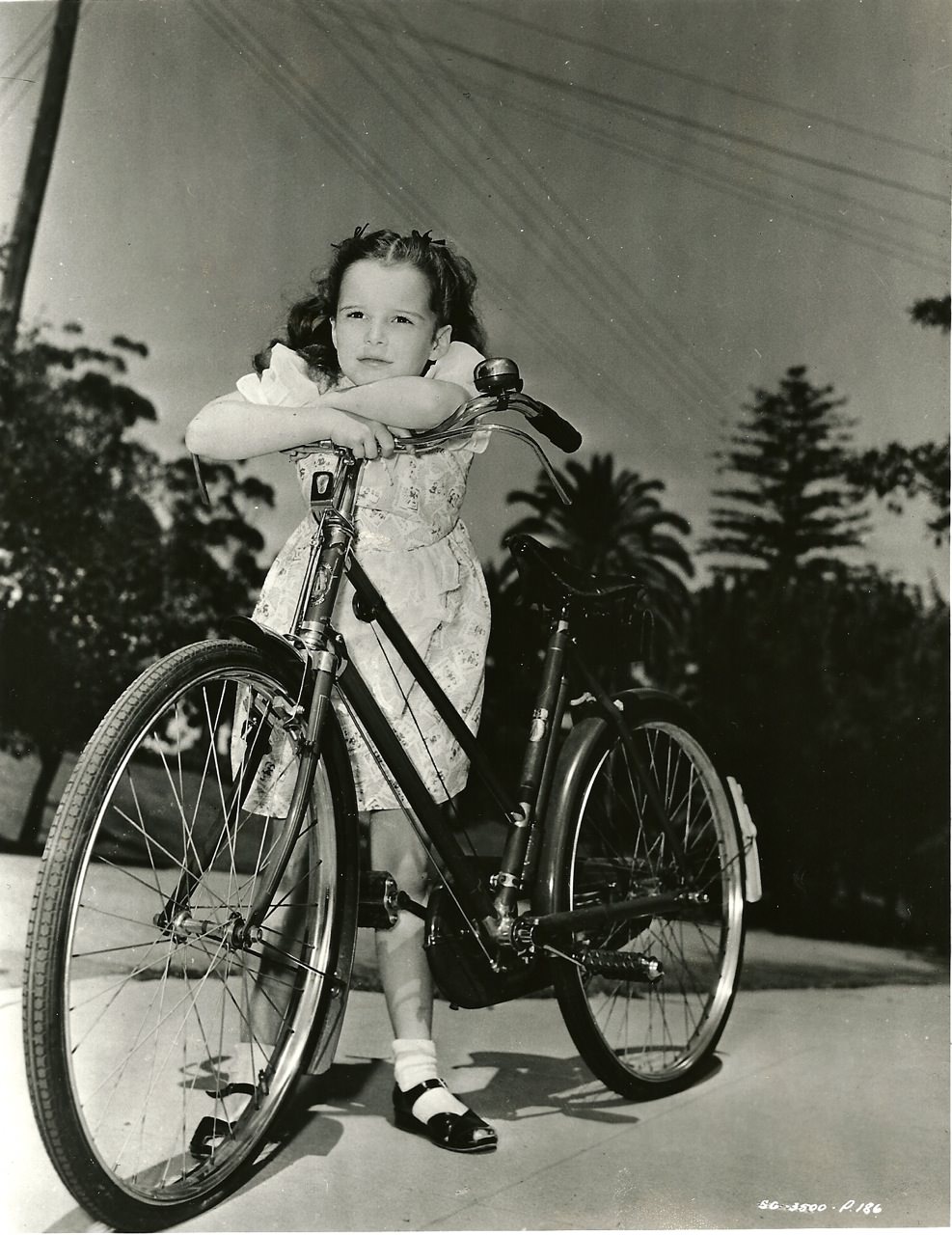 Gigi Perreau Considers A Bike, 1948