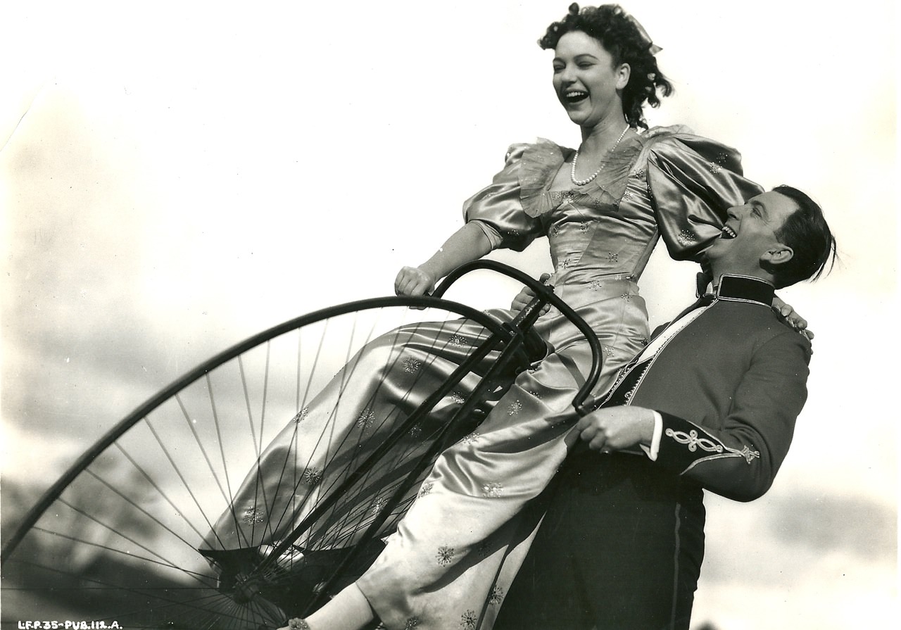 June Duprez Rides A Bike. John Clements Gives A Hand. 1939