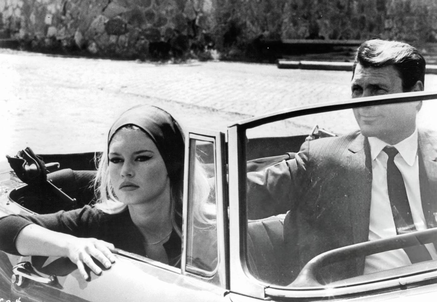 Brigitte Bardot And Jack Palance In A Convertible In A Scene From 'Contempt', 1963.