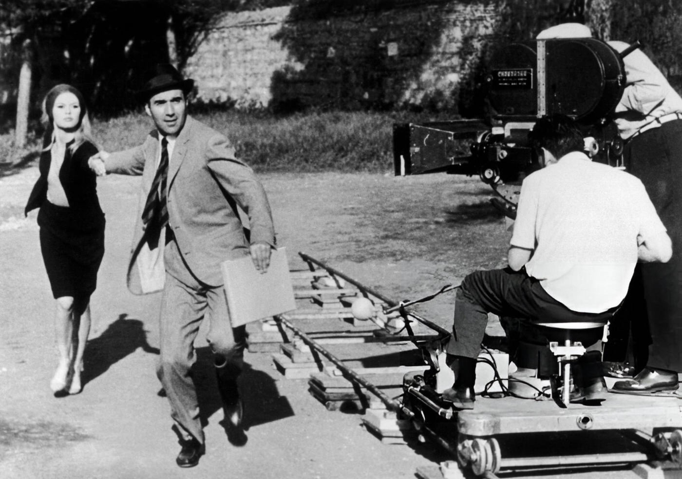 Michel Piccoli And Brigitte Bardot Run In Front Of Jean-Luc Godard'S Camera During The Shooting Of 'Le Mépris', Rome, 1963.