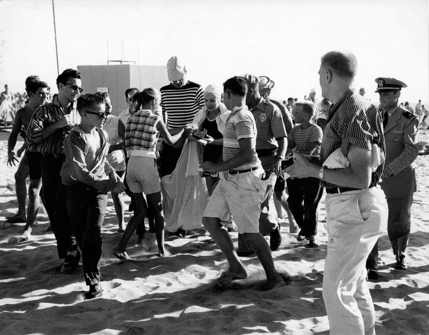 Marilyn Monroe Giving Autographs To Fans On Coronado Beach, California During Filming Of &Amp;Quot;Some Like It Hot&Amp;Quot;, Accompanied By Her Husband Arthur Miller, 1959.
