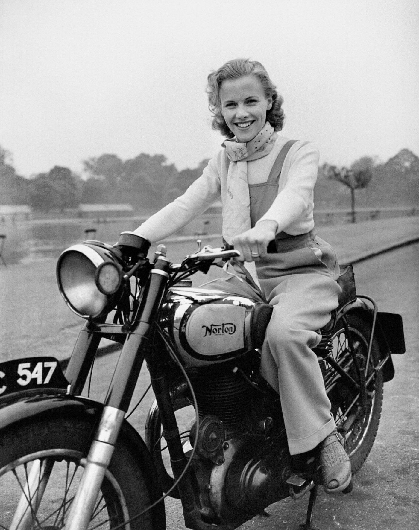 Honor Blackman Riding Her Norton Big Four Motorcycle Through Hyde Park In London, 1949.